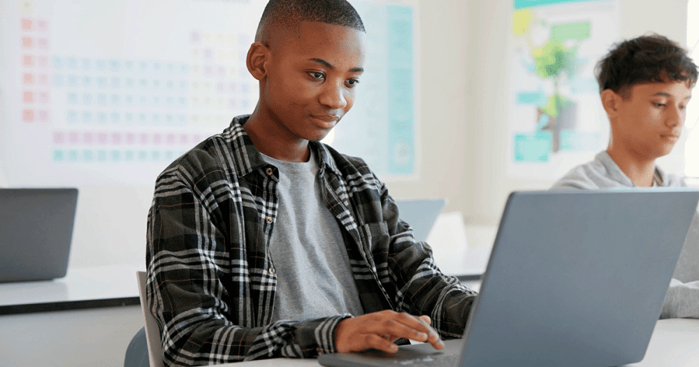 student using laptop to work